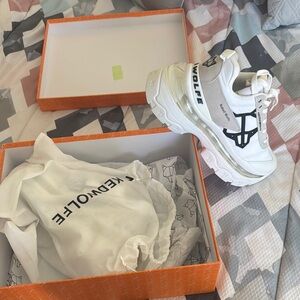 White and Black Sneakers by New Wolfe